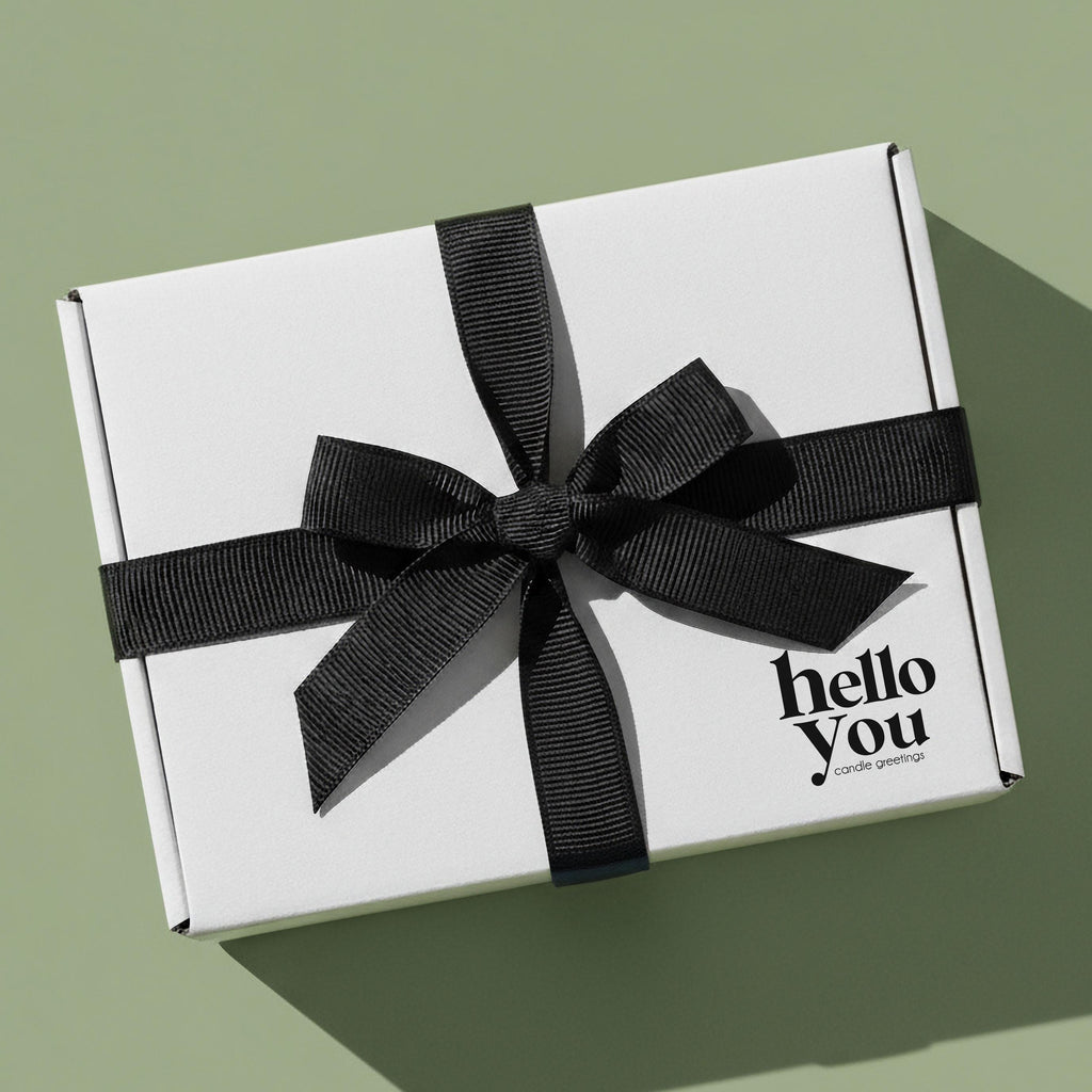Expecting Parents Gift candle gift set beautifully packaged in a white box with a black ribbon.