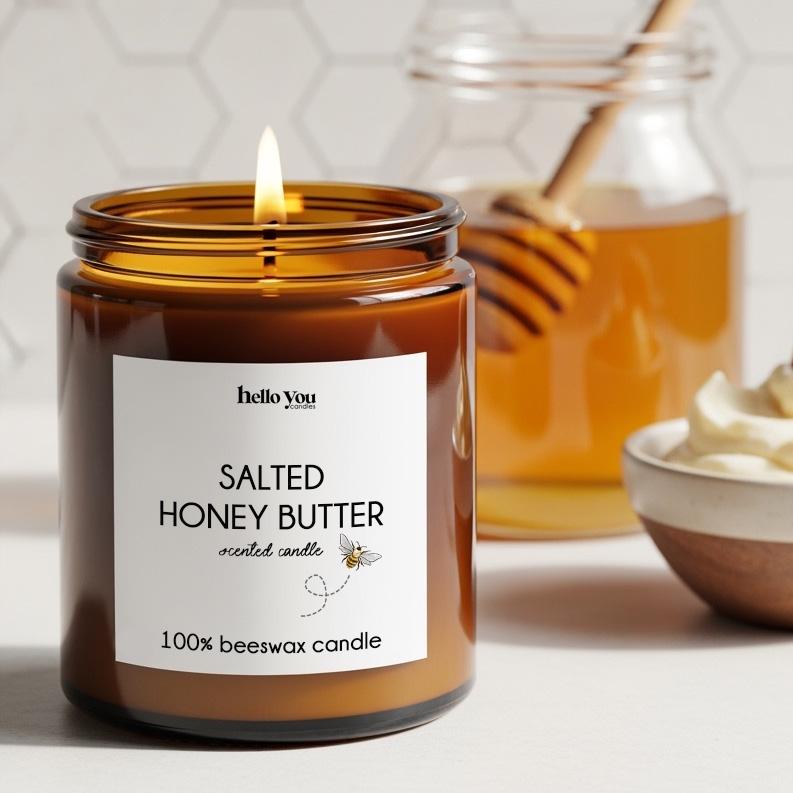 Beeswax Candles: Salted Honey Butter scented candle in amber jar with warm glow.