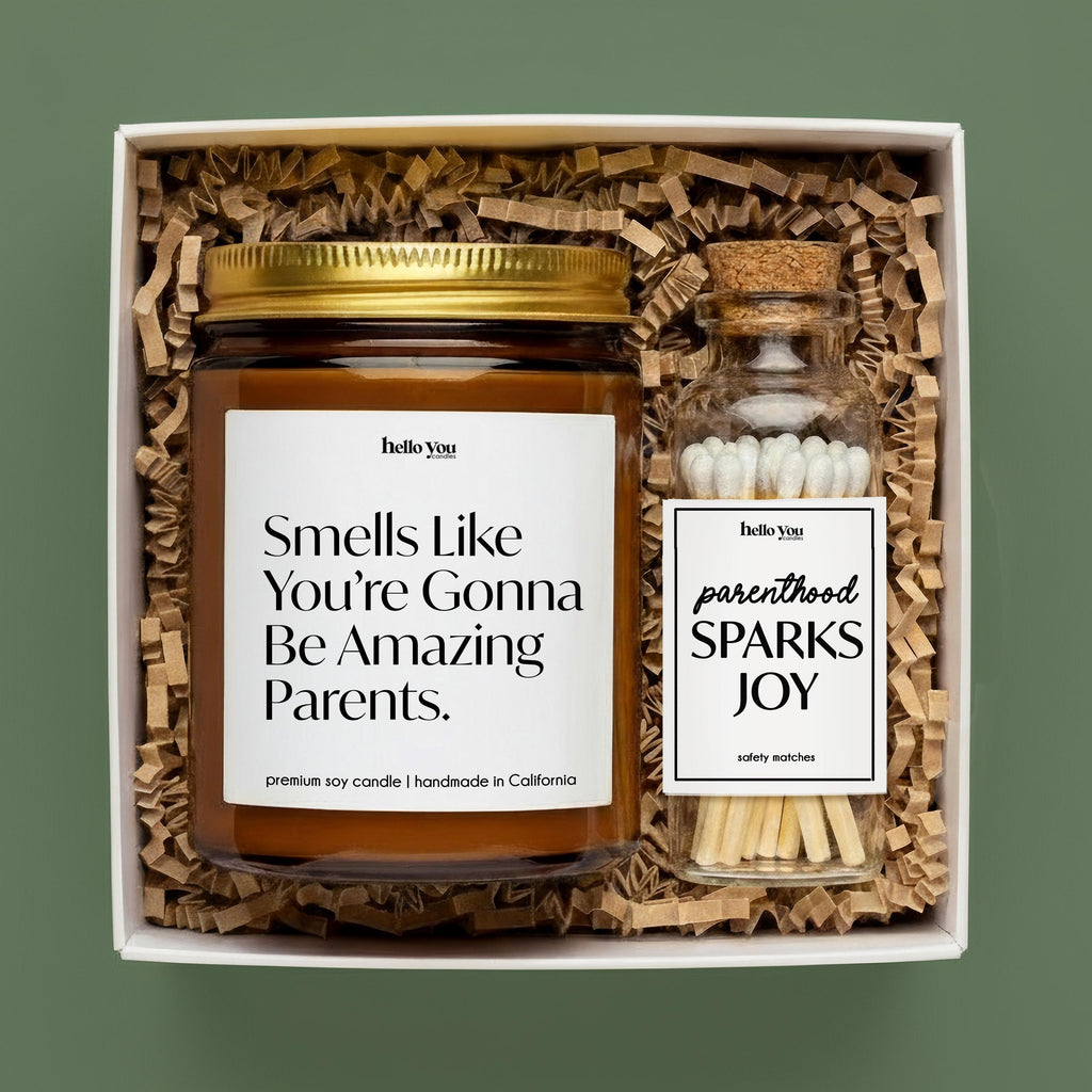Personalized New Parents Gift candle reading "Smells like you’re gonna be amazing parents" in a gift box.
