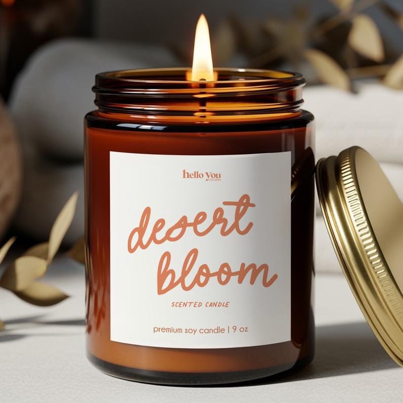 Desert Bloom Cactus Candle – Premium Soy Candle in an amber jar with a gold lid and a lit wick.